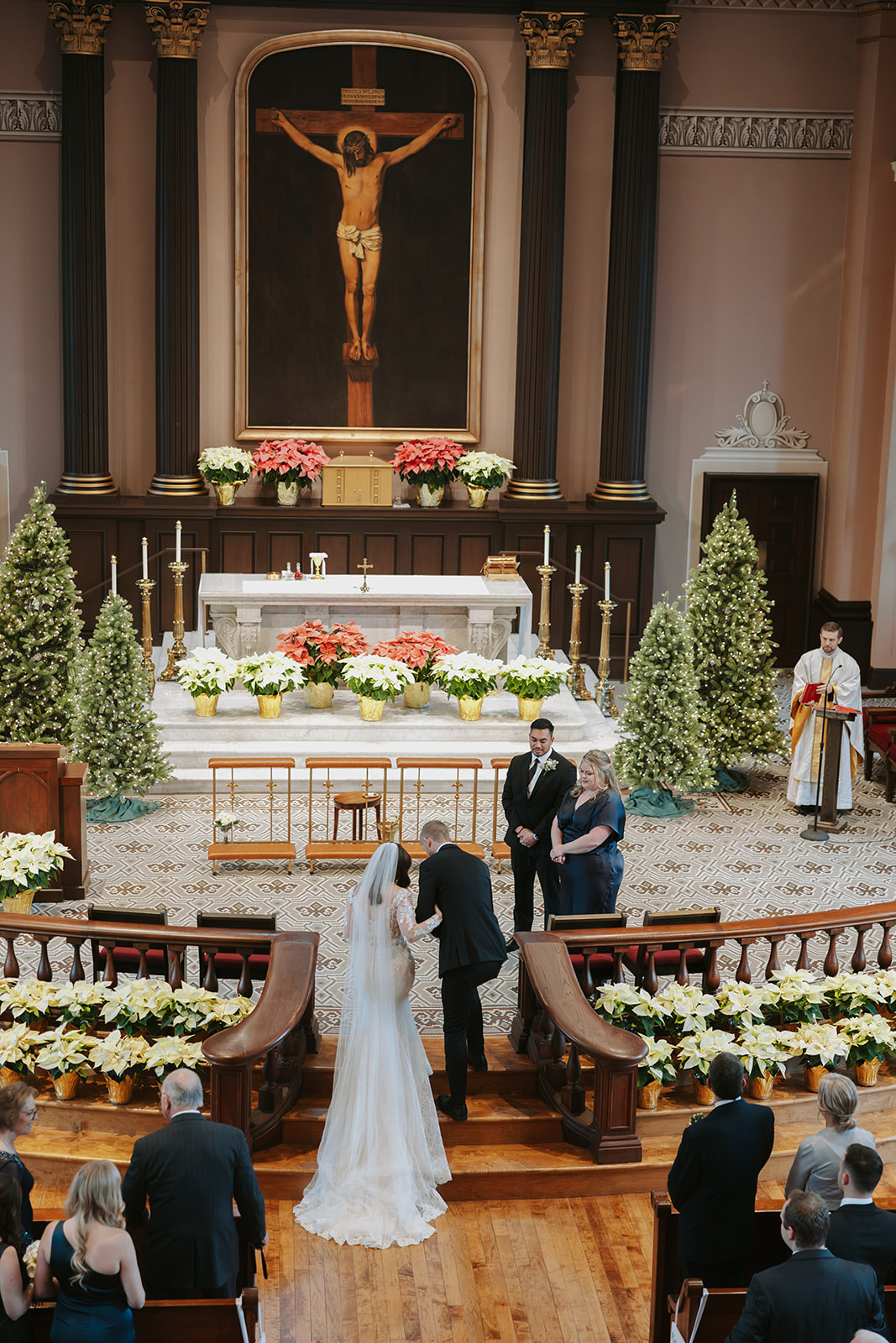 Catholic bride and groom walking to the altar at the Old Cathedral of Saint Louis the King in St. Louis, Missouri