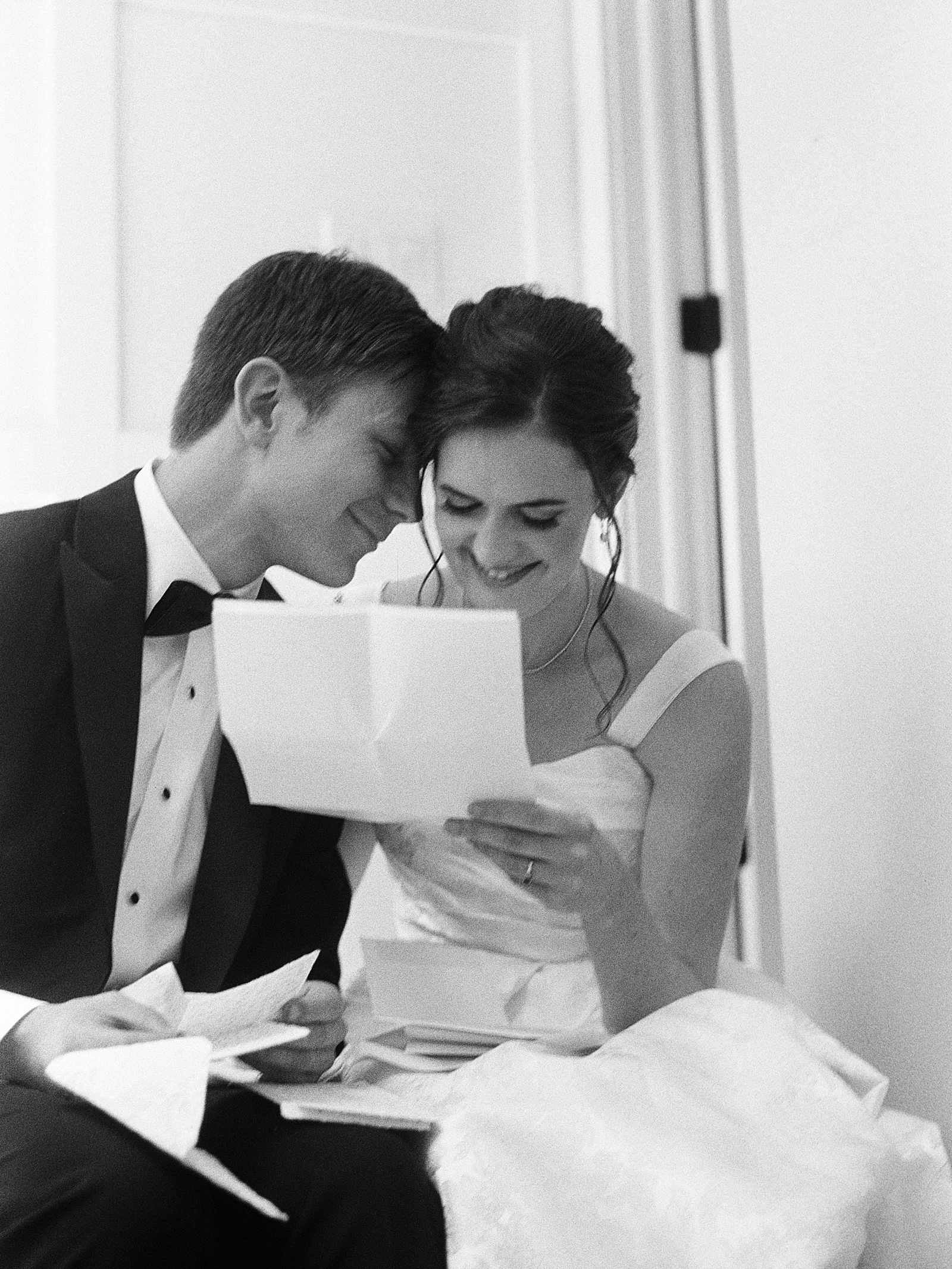 a catholic couple reads letters to each other on their wedding day at saint mary of the angels opus dei church in chicago illinois