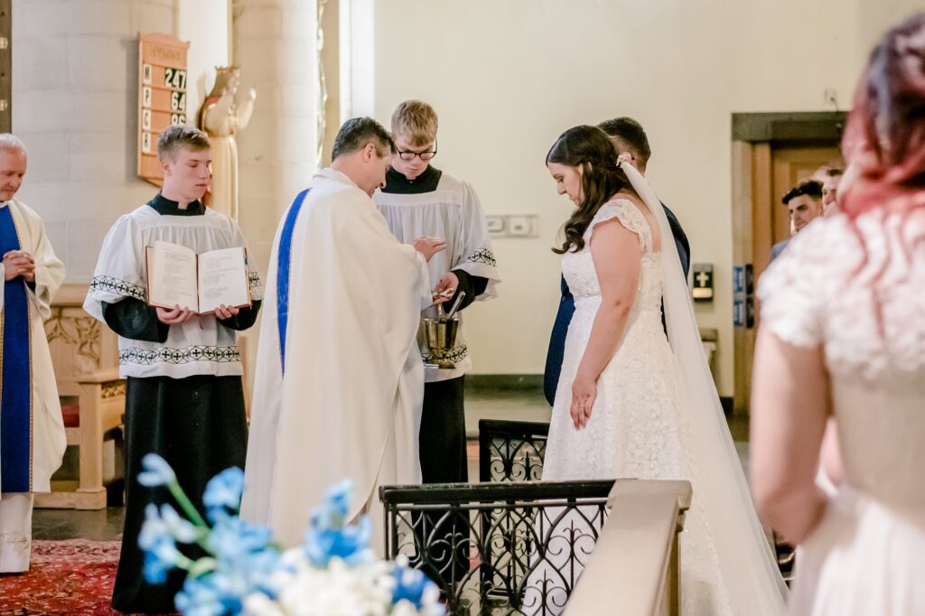 A bride and groom at a Catholic wedding 