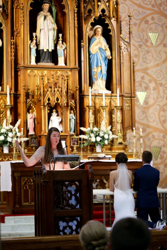 Musician, Angela Marie Rocchio, singing for a Catholic wedding mass