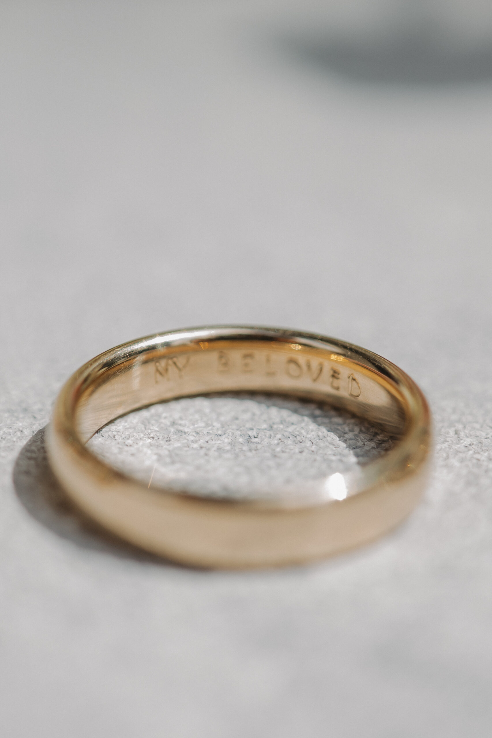 The Groom's Wedding band, inscribed with "My Beloved" 