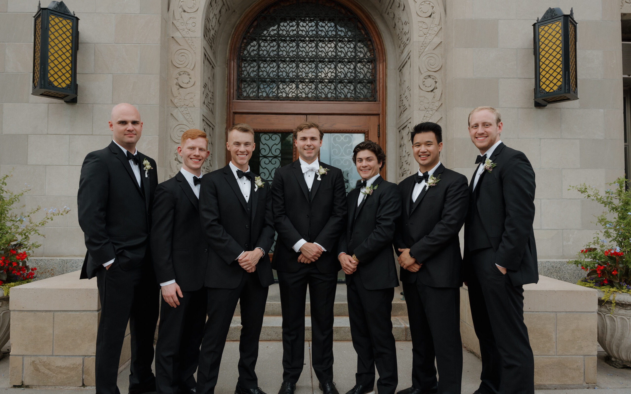 The Groom and his Groomsmen pose in front of Creighton Hall.