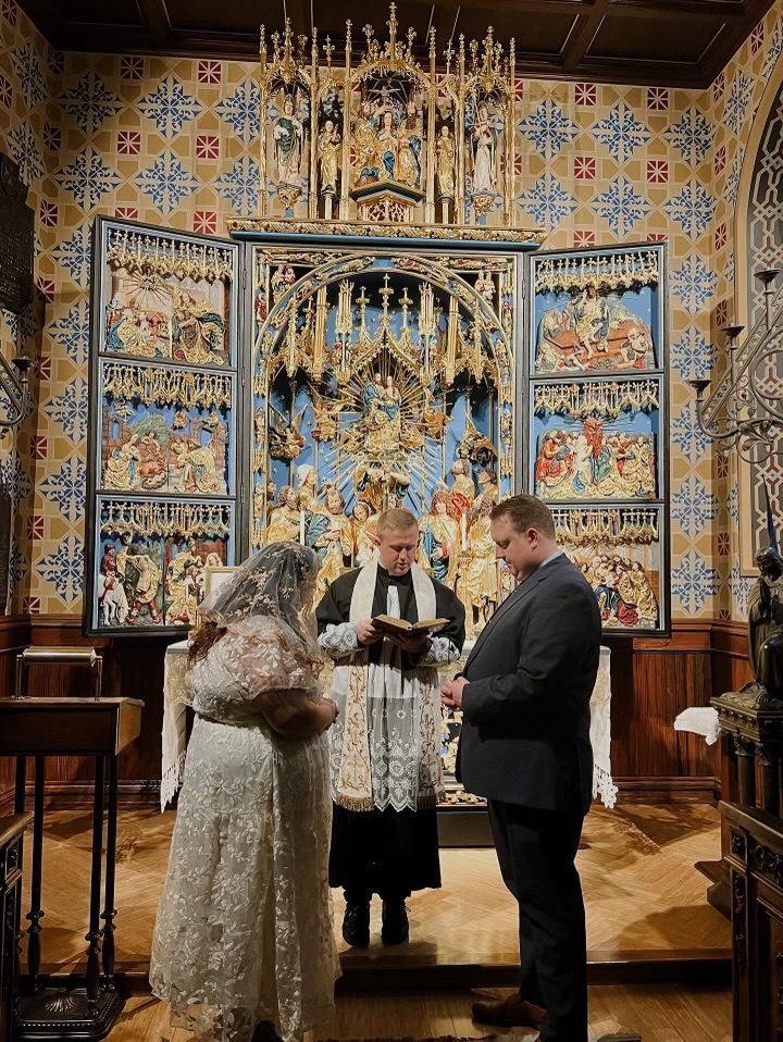 A couple having a Catholic Betrothal Ceremony at St. John Cantius in Chicago