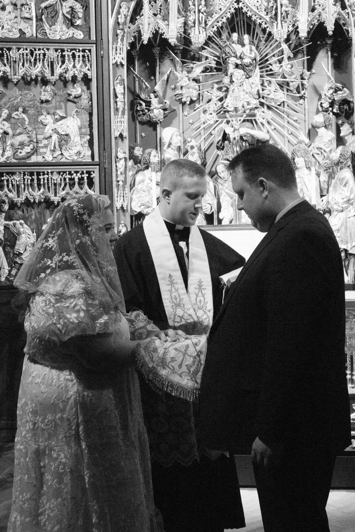 A couple having a Catholic Betrothal Ceremony at St. John Cantius