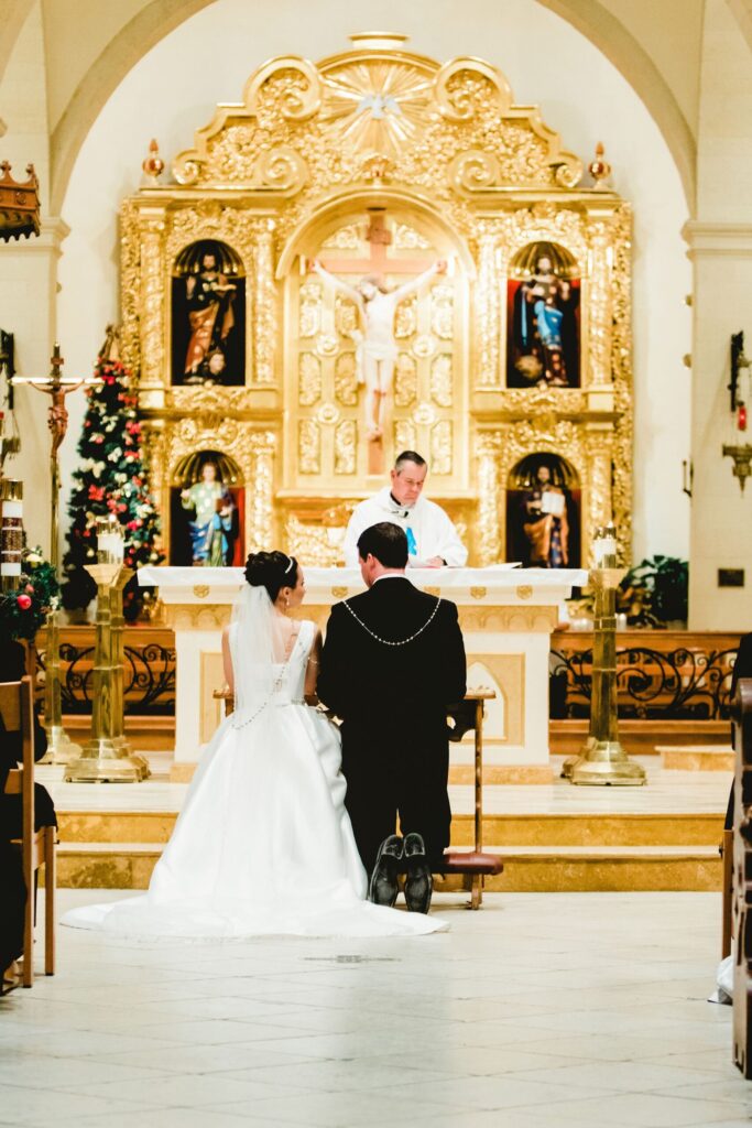 Catholic wedding mass with rosary lasso around the bride and groom.