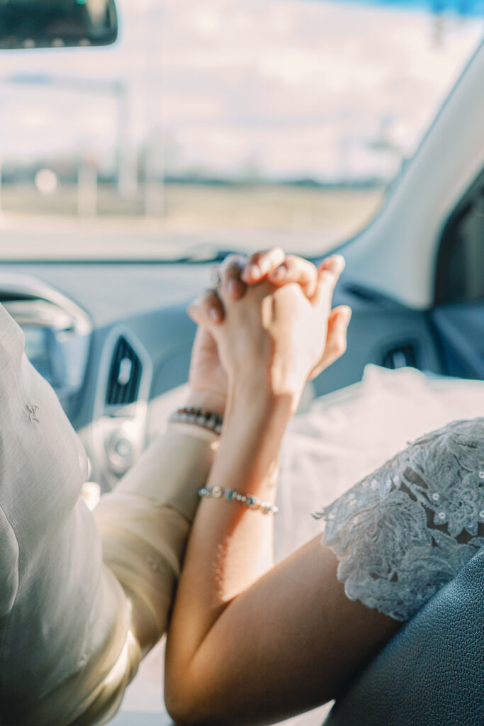 A Catholic bride and groom holding hands 