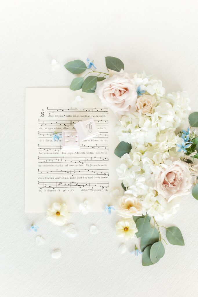 A photo of sheet music decorated by flowers