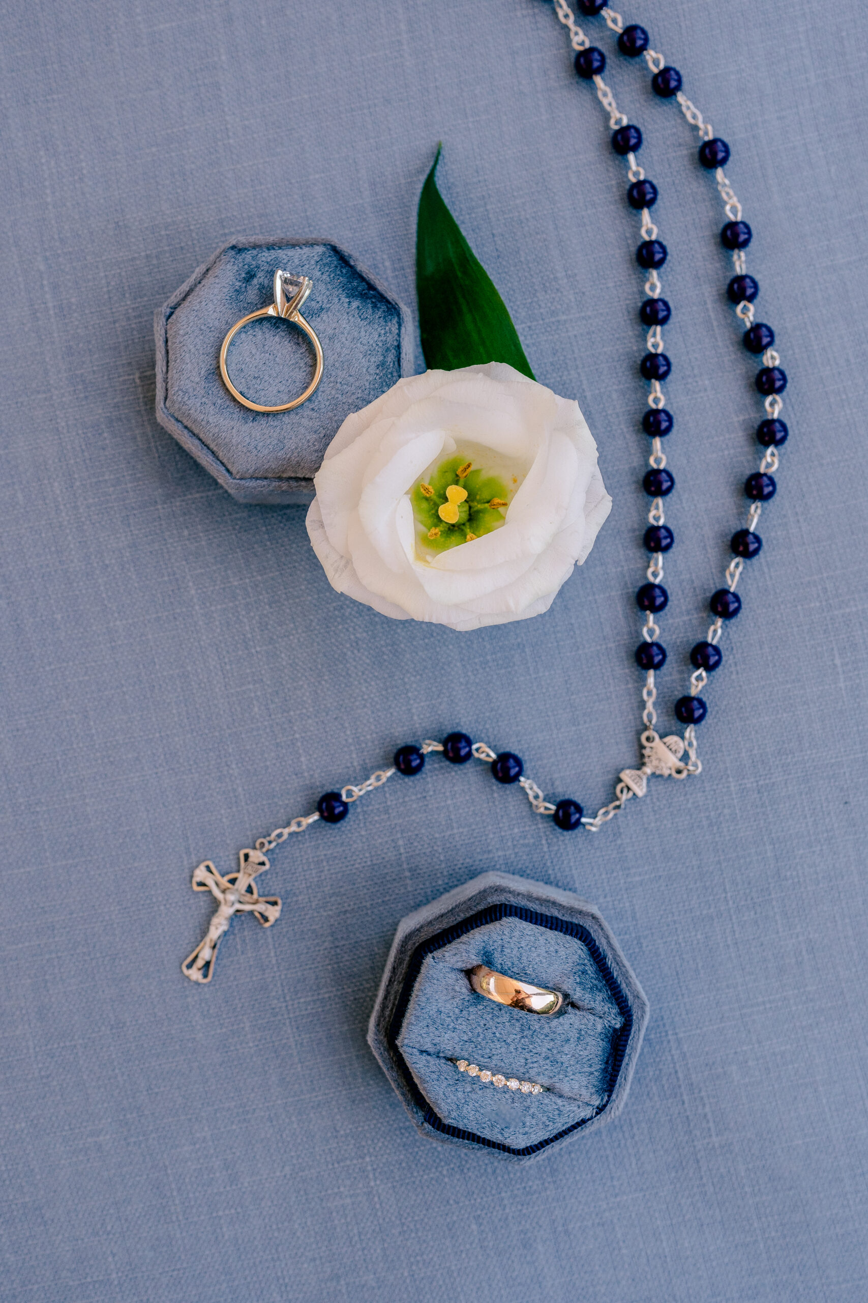 A rosary on a blue background
